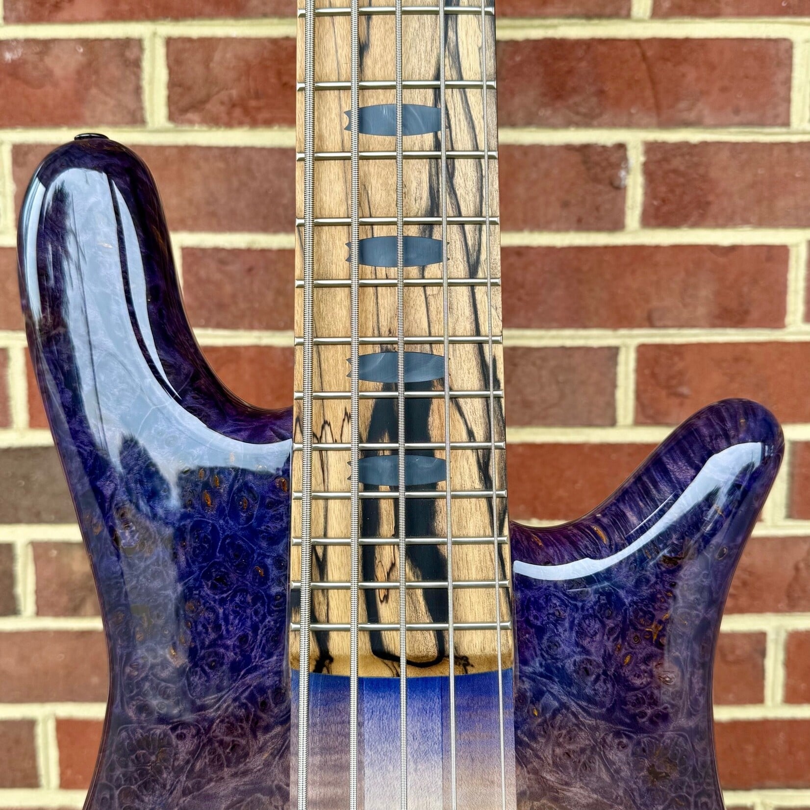 Spector Spector USA NS-5XL, Natural to Purple Burst, Maple Burl Top, Swamp Ash Body, 3pc Maple Neck, Pale Moon Ebony Fretboard, Black Mother of Pearl Crown Inlays, EMG P5X/SJ5X Pickups, HAZ 9-Volt, TSA Case