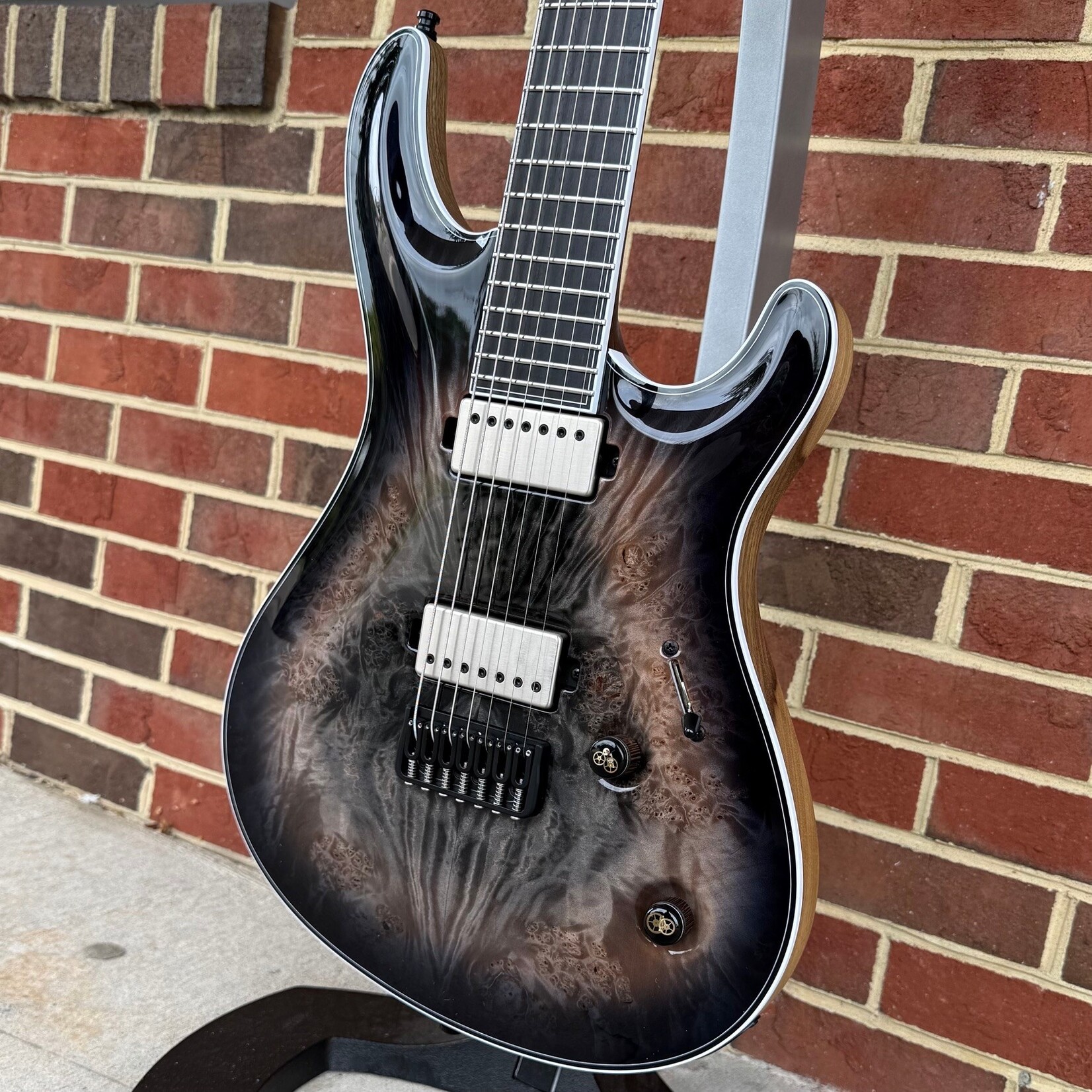 Mayones Mayones Regius Core 7 B26.5, Galaxy Eye Black, 5A Maple Burl Top, Black Limba Body, 11pc Wenge/Mahogany/Purpleheart/Maple Neck, Ebony Fretboard, Hipshot Bridge, Clockwork Knobs, Velvetrone Ironside + Solium Pickups, Mayones Hybrid Double Deck Case