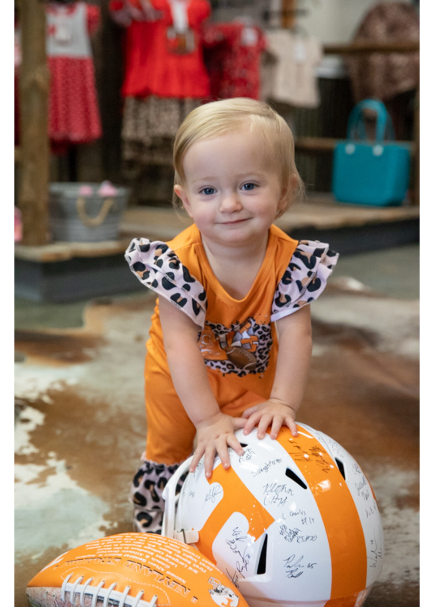 Clover Cottage Leo Football Orange Romper