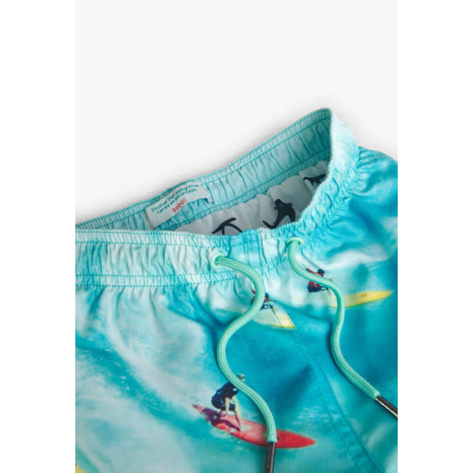 Boboli BOBOLI- Turquoise swimshorts with surfer print