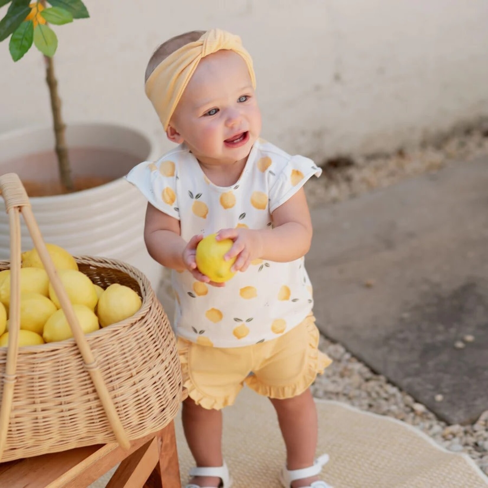 Petit Lem PETIT LEM - Ensemble deux pièces t-shirt à manches courtes imprimé de citron et son short à volants jaune