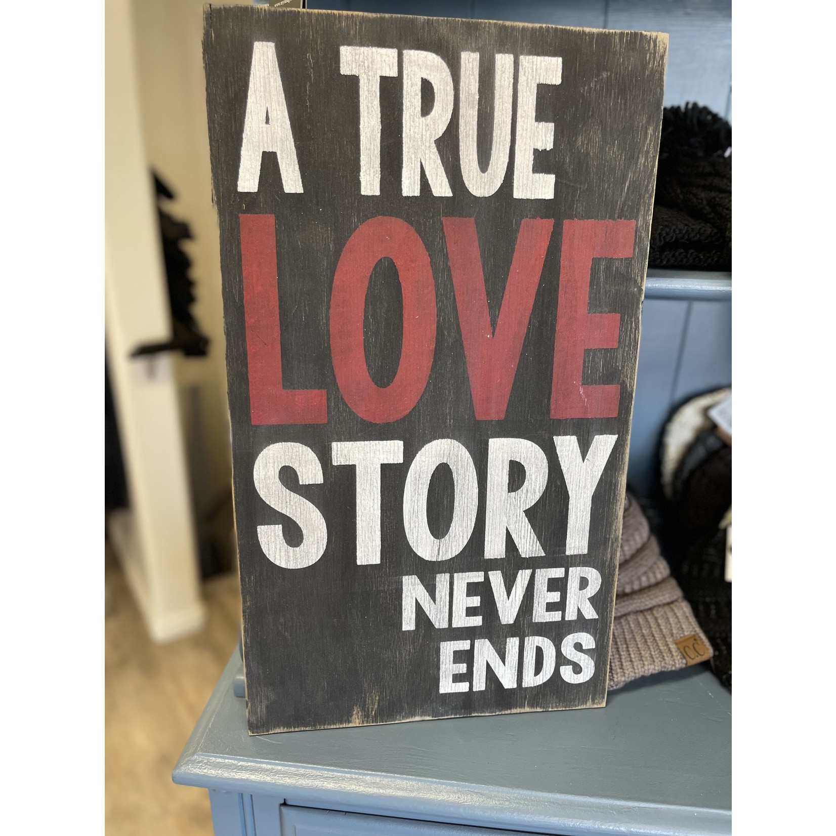 Home Saying " A True Love Story Never Ends" on  wood