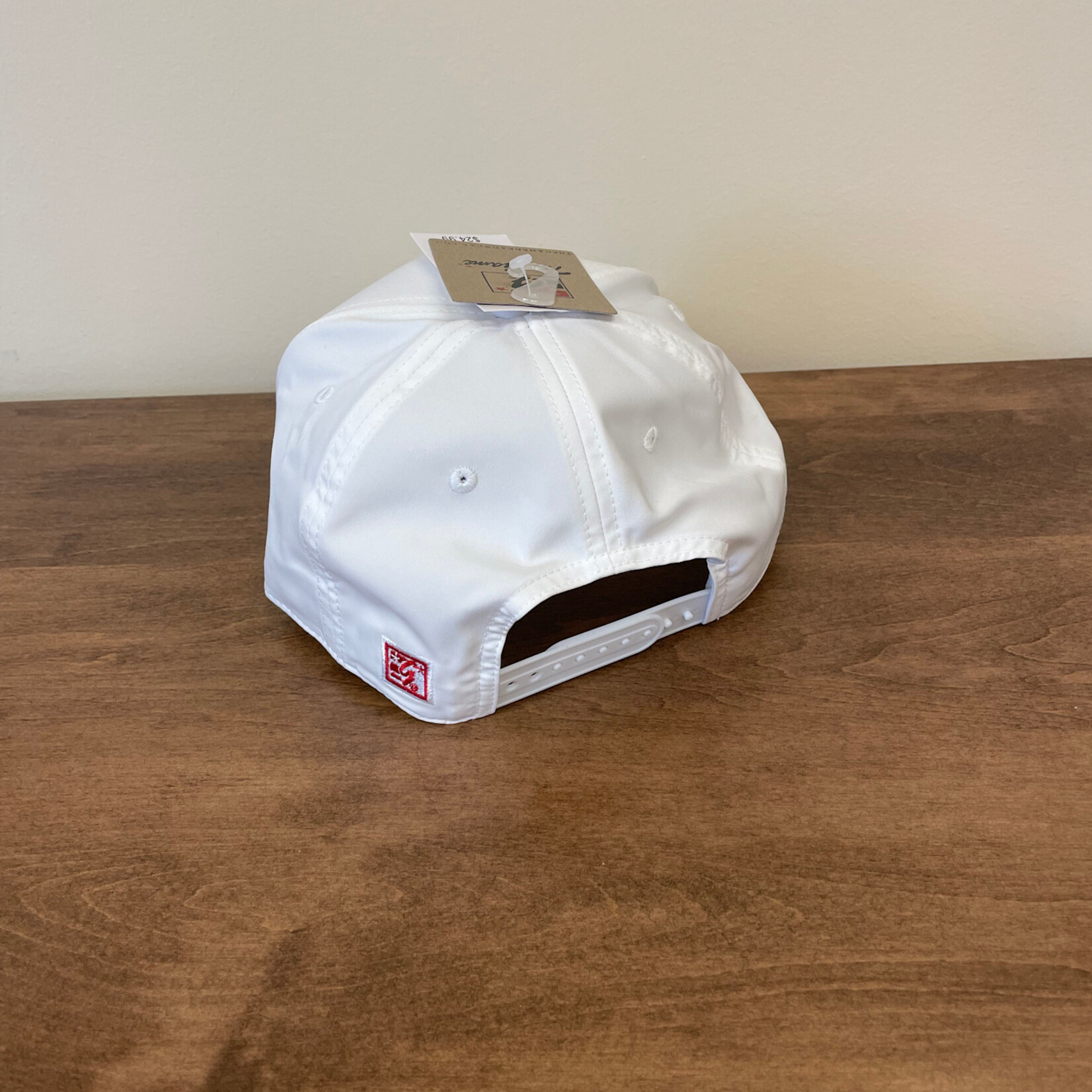 White cap w/red rope