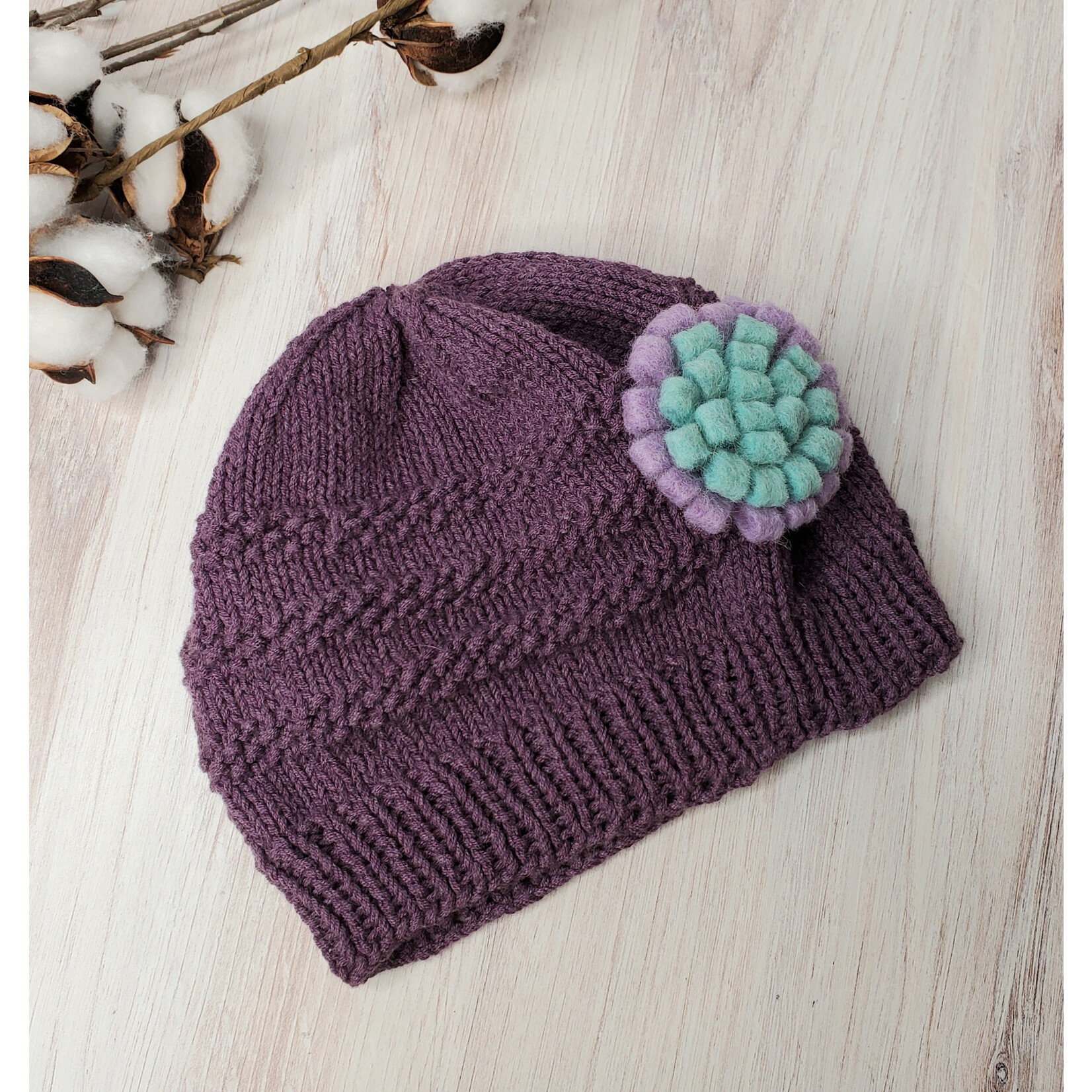 Roan's Repertoire Baby Hat - Purple w/ flower pin  - 3-12 mos. - hand knit