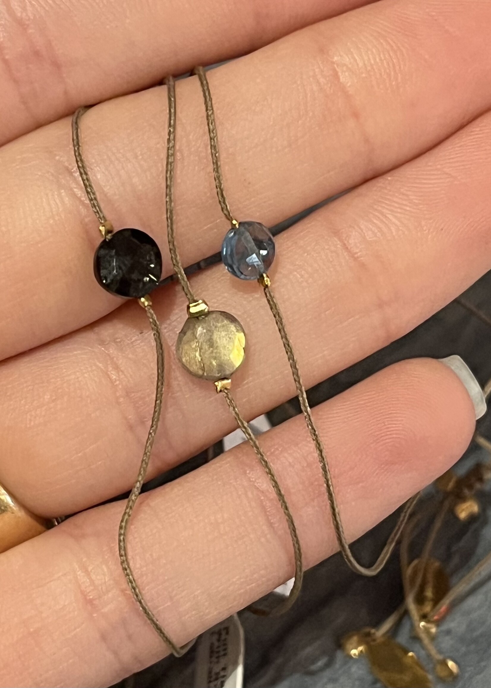 Pull Tie Bracelet With Round Labradorite, Blue Topaz or Onyx With Two Gold Beads On Each Side On Taupe Cord
