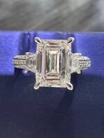 18kW 2.51ct Emerald Cut LabGrown Diamond G/VS1 with .85ctw accent diamonds.
