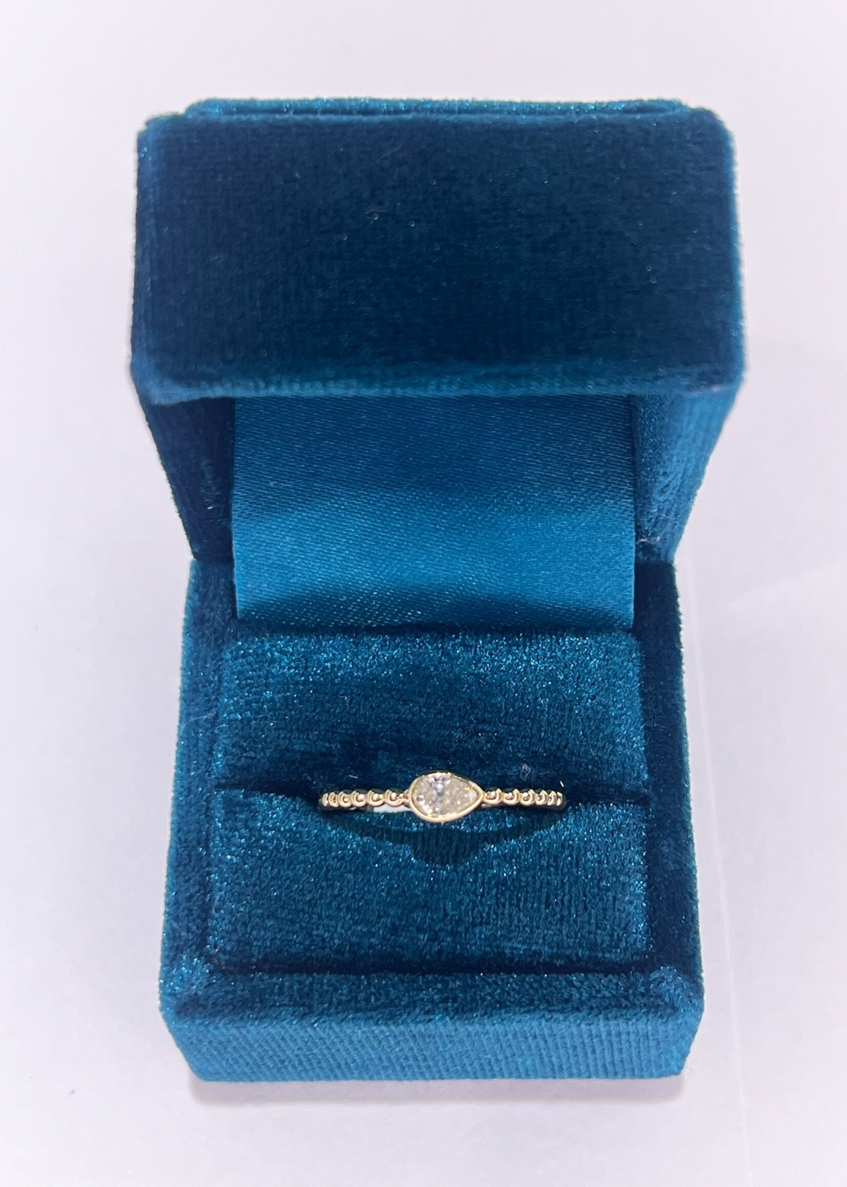 14kY .21ct pear cut diamond bezel set with beaded band, stackable!