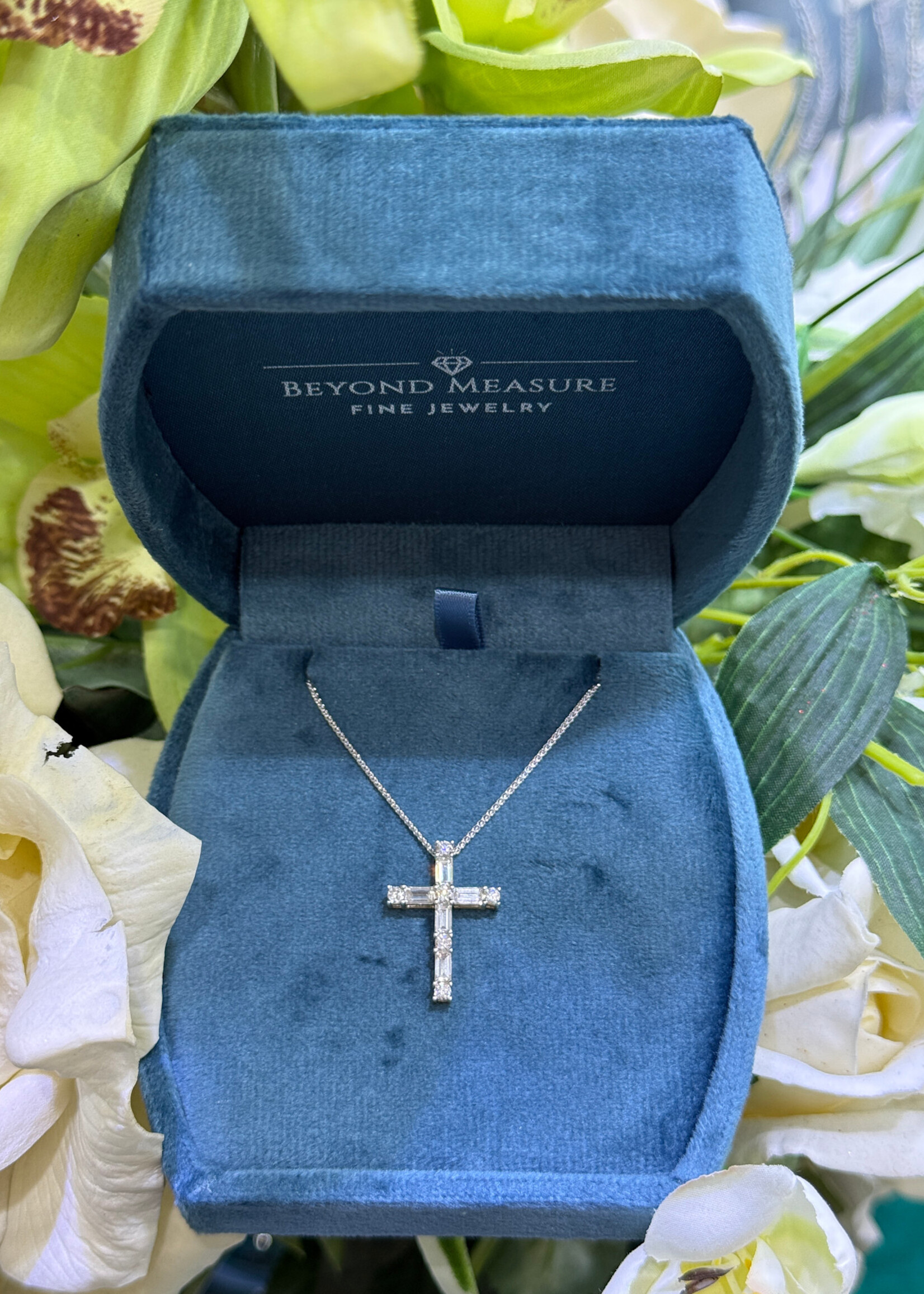 14kY/W 1/2ctw Natural Diamond Cross with Baguette and Round Cut Diamonds.