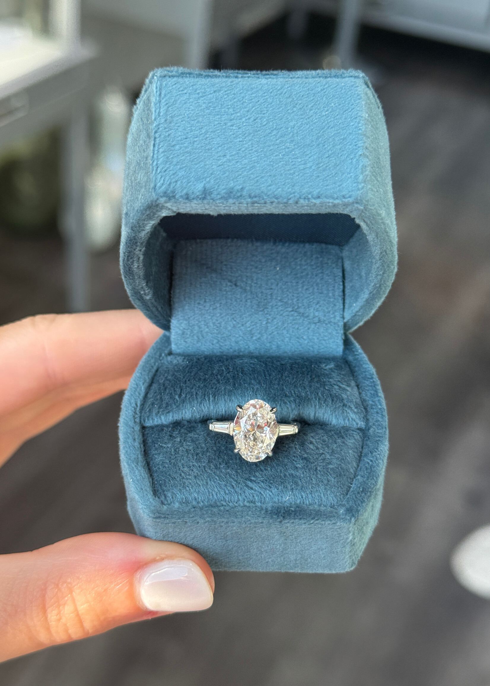 Platinum 3.53carat Naturally Mined Oval Cut Engagement Ring GIA L,SI1  with tapered baguette side stones.