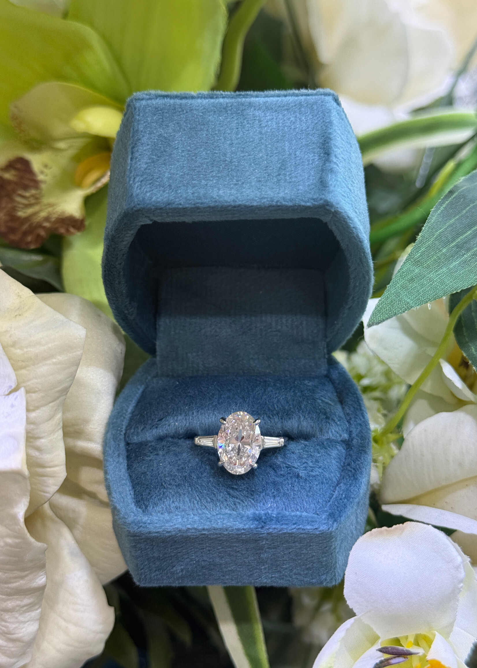 Platinum 3.53carat Naturally Mined Oval Cut Engagement Ring GIA L,SI1  with tapered baguette side stones.
