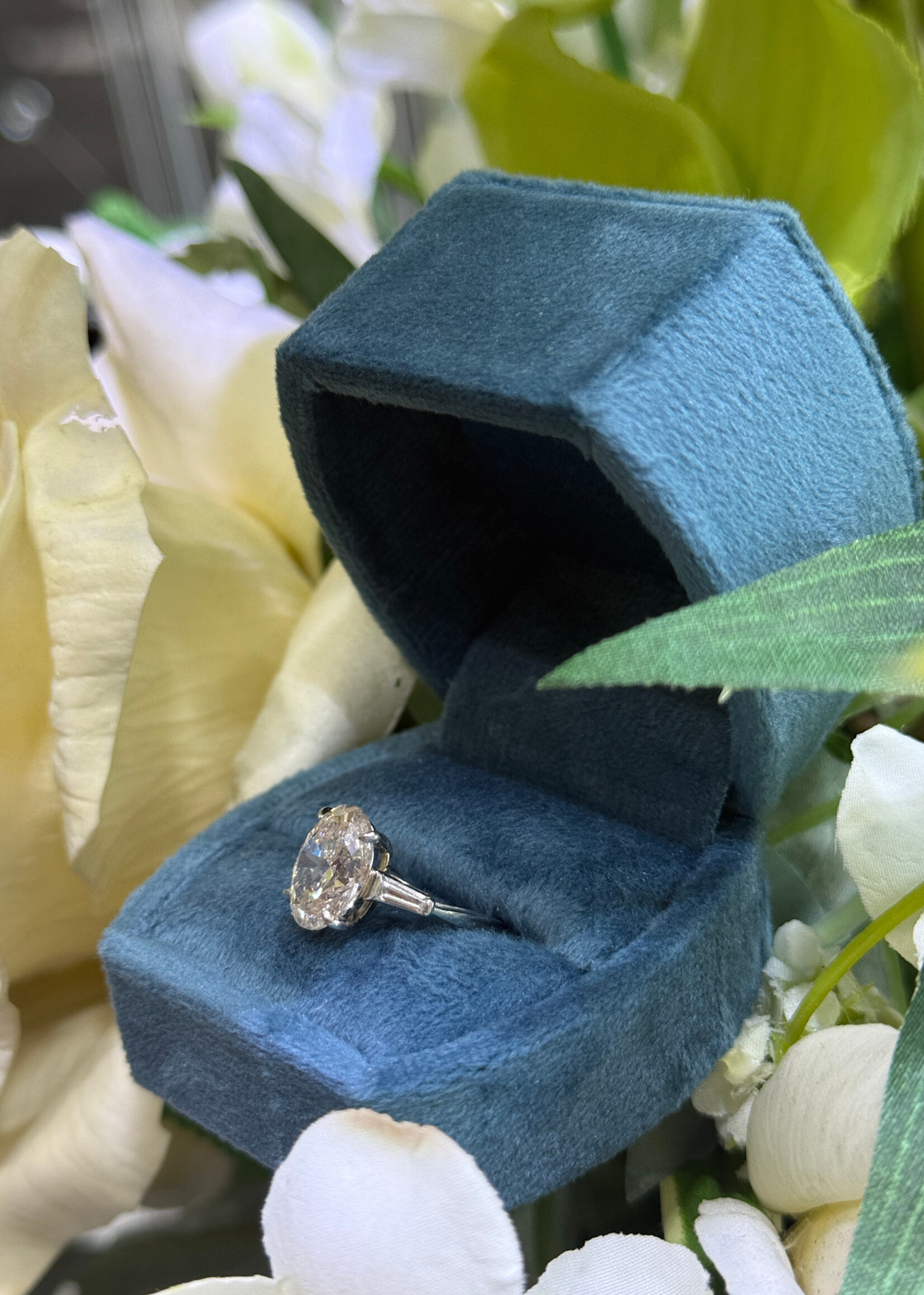 Platinum 3.53carat Naturally Mined Oval Cut Engagement Ring GIA L,SI1  with tapered baguette side stones.