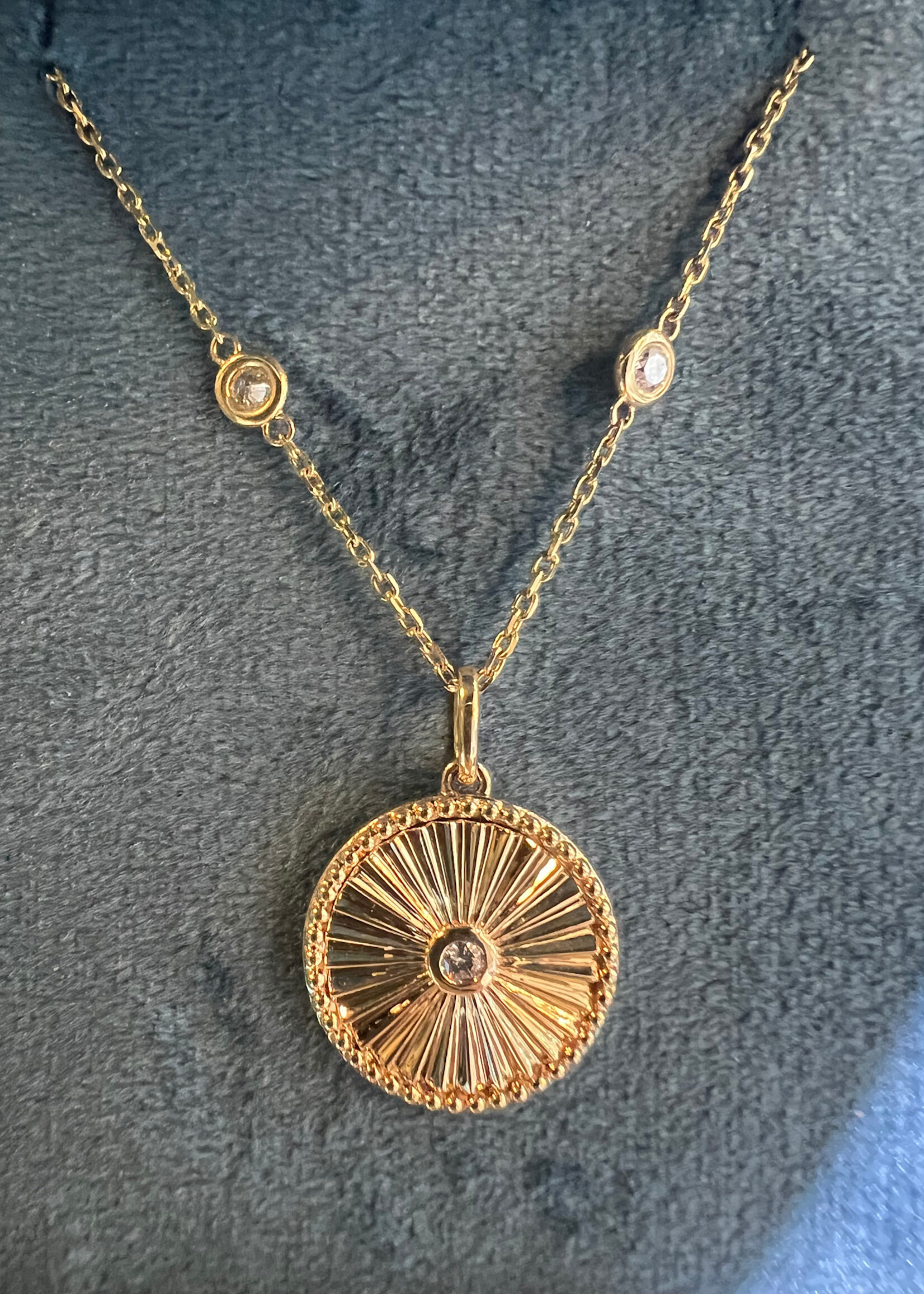 14kY Gold Disk pendant with bezel set diamond. On  14kY .80ctw Diamonds by the inch chain.