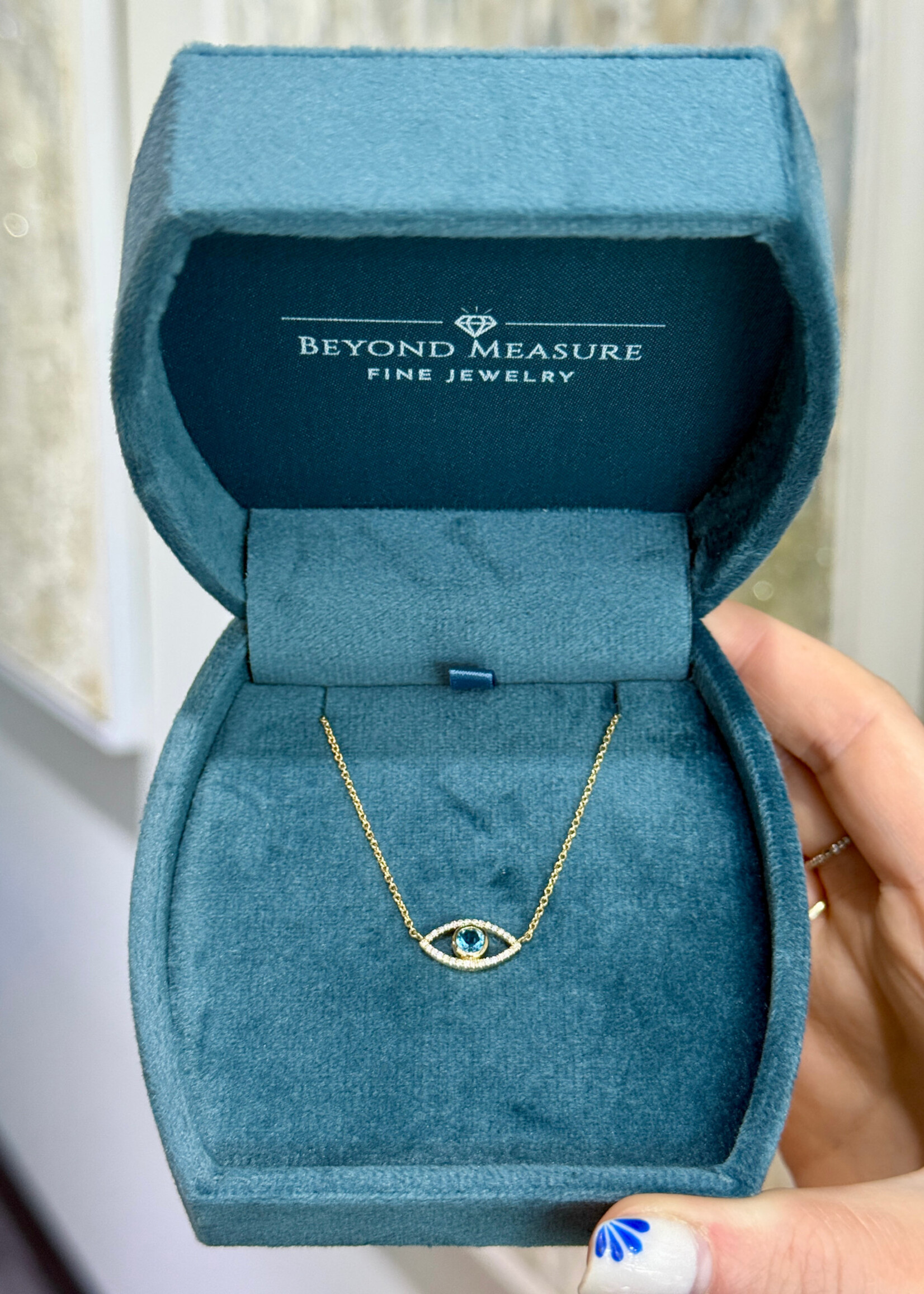 14kY .08 Natural Diamond Blue Topaz Evil Eye Pendant