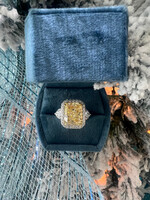 14k 9.01ct Natural Fancy Yellow Diamond, I1 with a halo and pear cut side diamonds