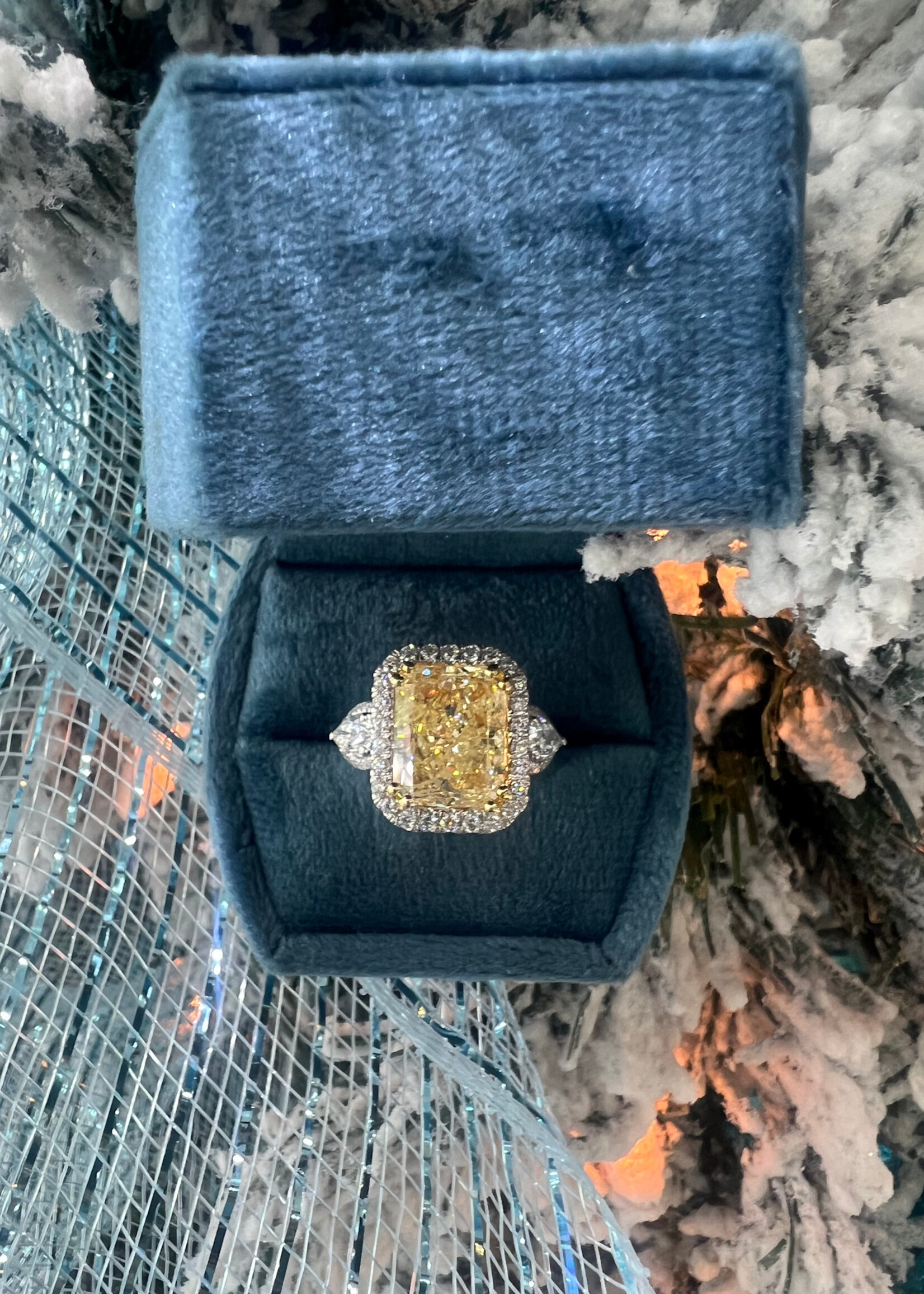 14k 9.01ct Natural Fancy Yellow Diamond, I1 with a halo and pear cut side diamonds