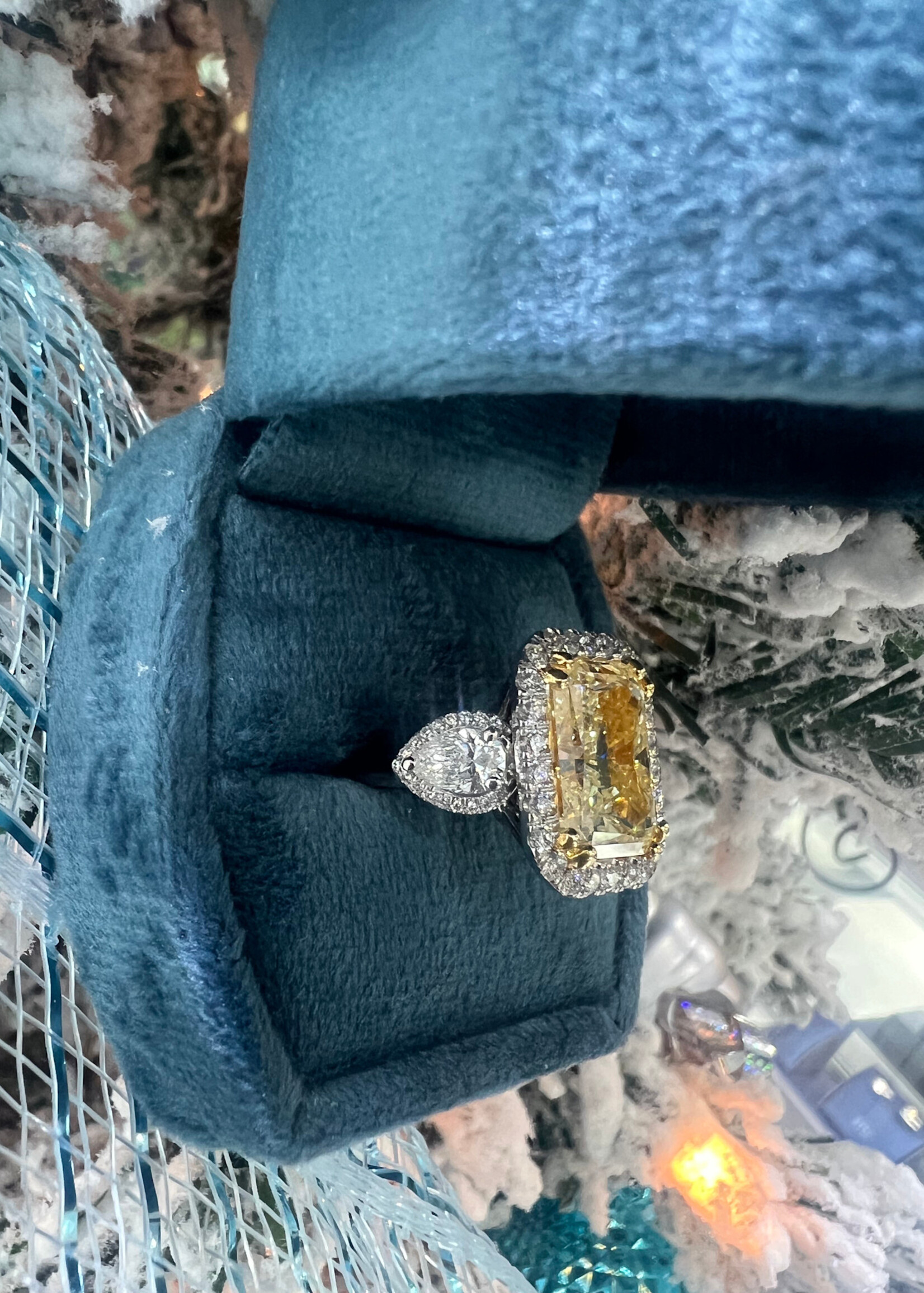 14k 9.01ct Natural Fancy Yellow Diamond, I1 with a halo and pear cut side diamonds