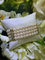 18k yellow gold four strand Pearl Bracelet with approximately 2.10 carats of princess cut diamonds.