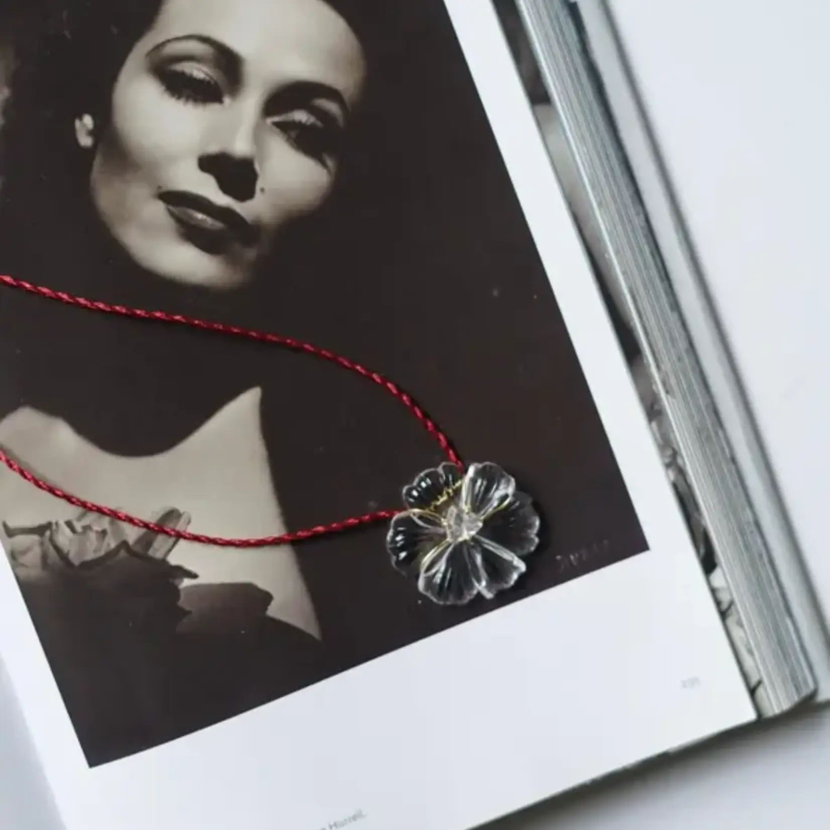 HAND CARVED NATURAL STONE PENDANT