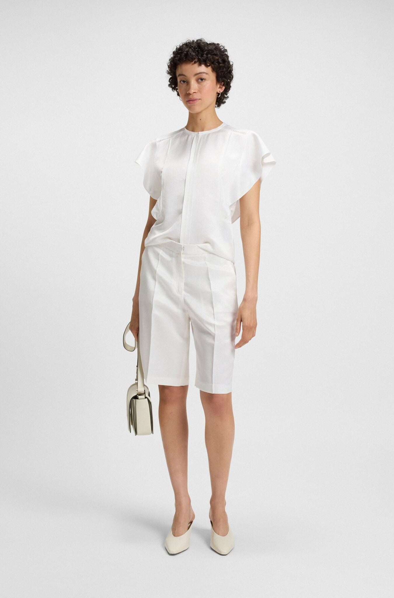 Frill-sleeve blouse with crochet-style trims