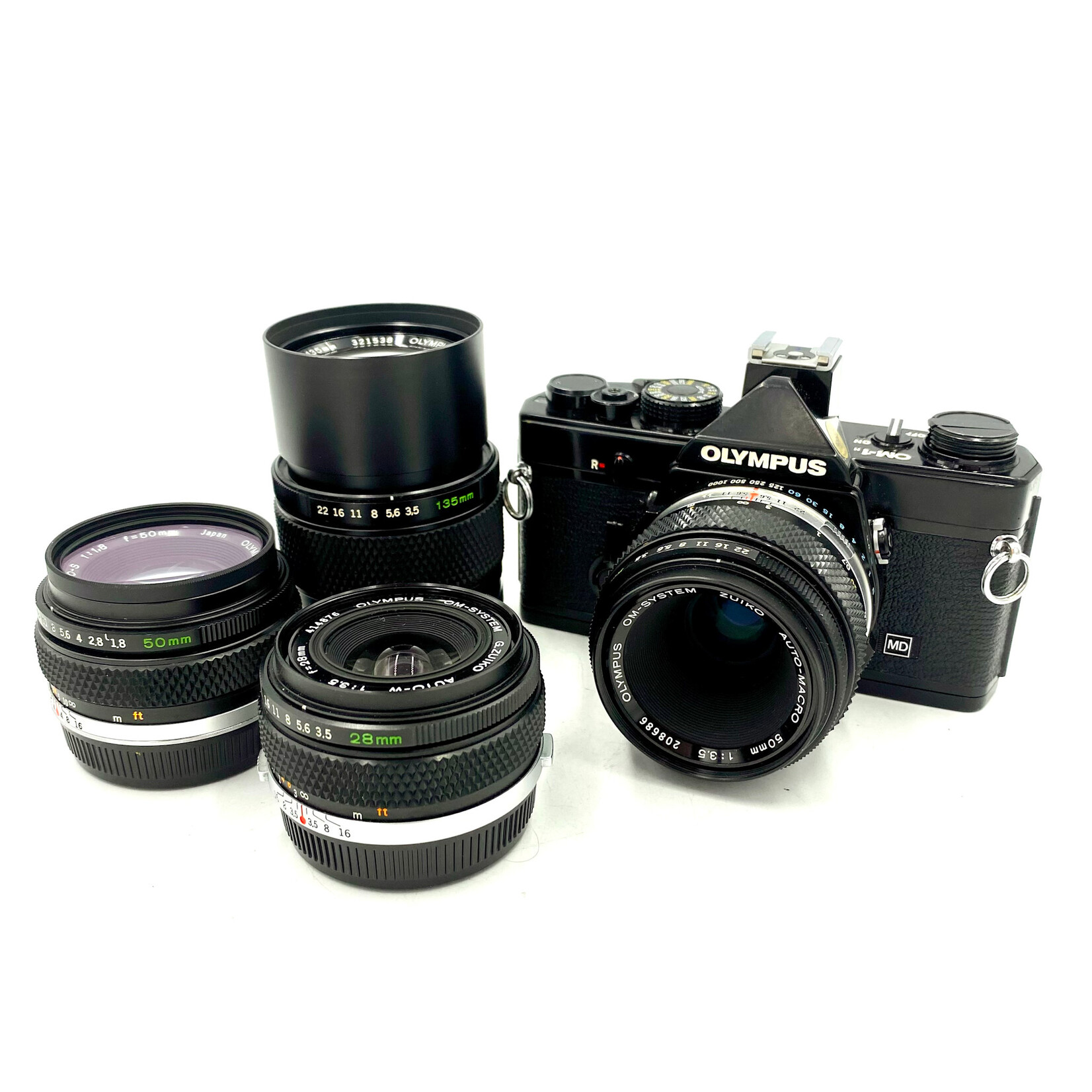 Olympus #1565 Olympus OM-1n Film Camera w/ 4 lens kit