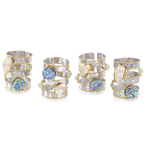 The John Richard Collection, LLC A Set of 4 Abalone & Pearl Napkin Rings