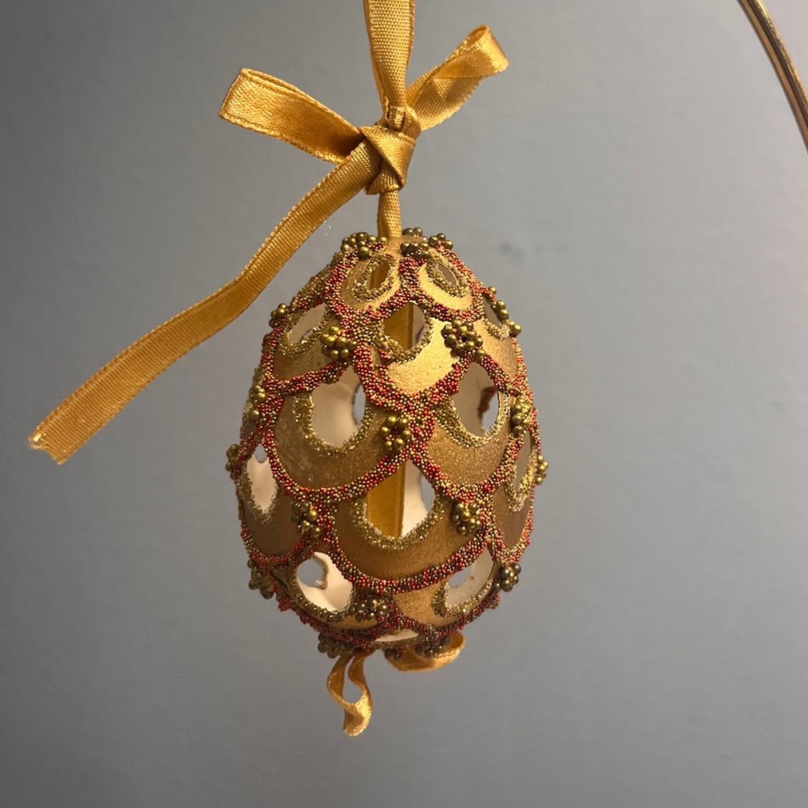 Peter Priess Handcrafted Cut Out Egg Ornament with Gold & Red Beads