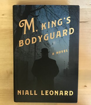 Niall Leonard - M, King’s Bodyguard - Hardback (USED)