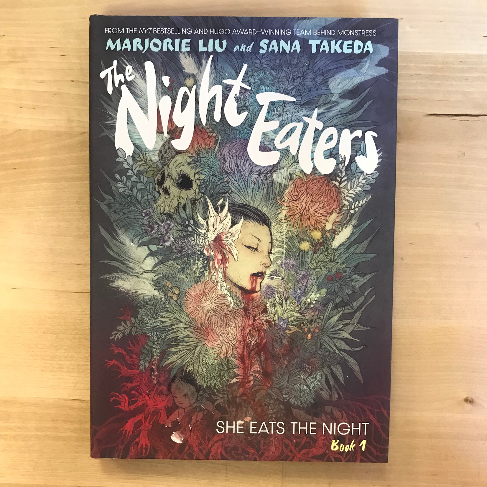 Marjorie Liu, Sana Takeda - The Night Eaters - Book 1: She Eats The Night - Hardback (NEW)