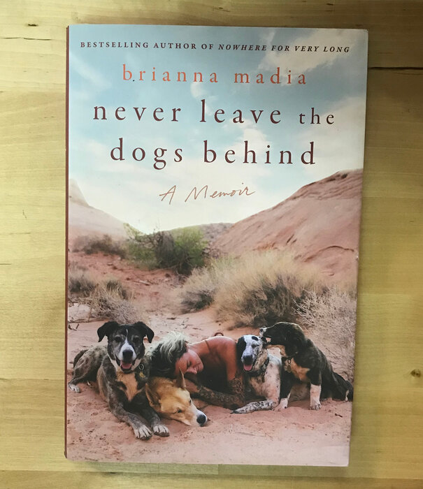 Brianna Madia - Never Leave The Dogs Behind - Hardback (NEW)