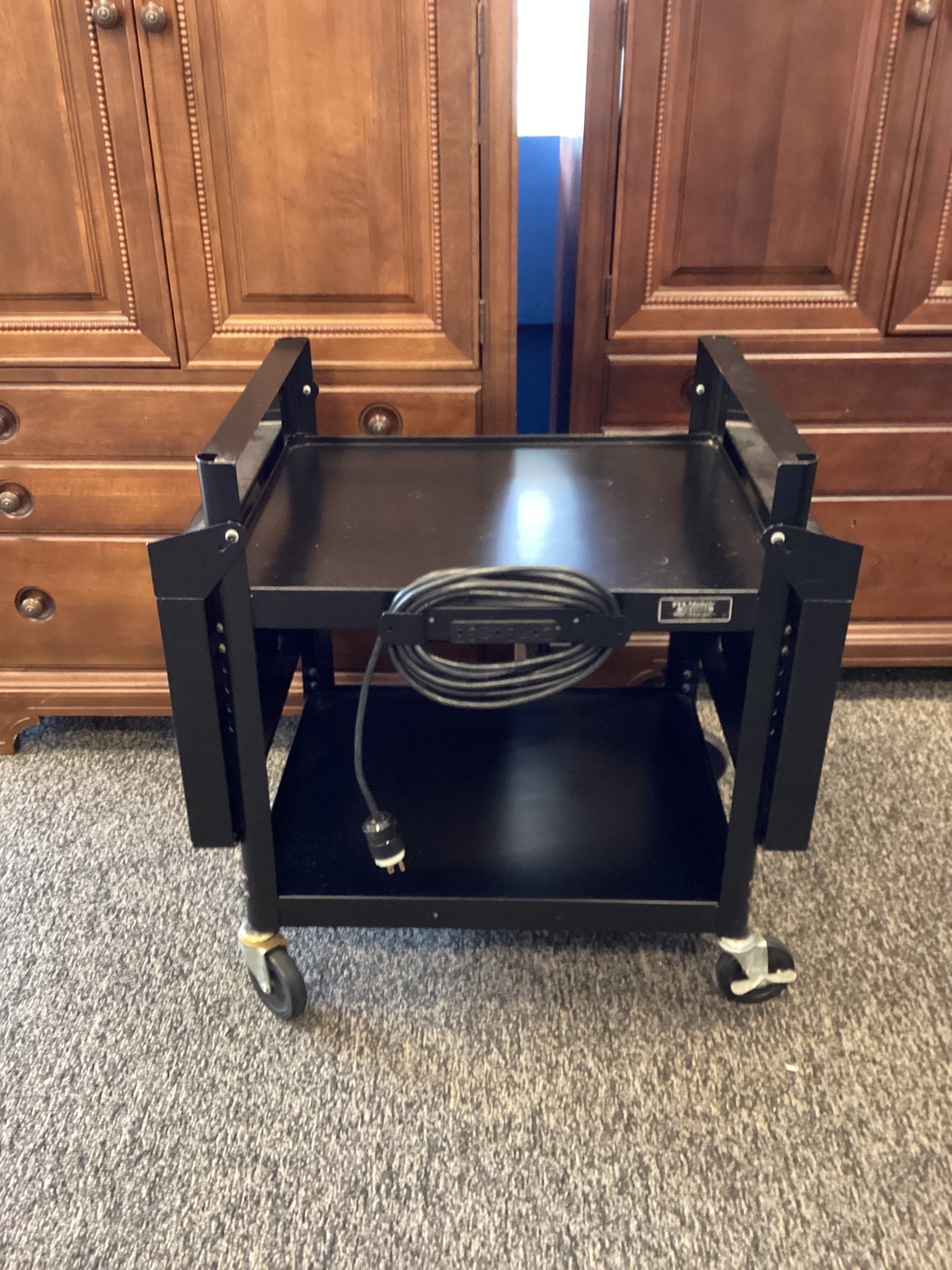 Black rolling cart with cord attachment GVSU Surplus Store