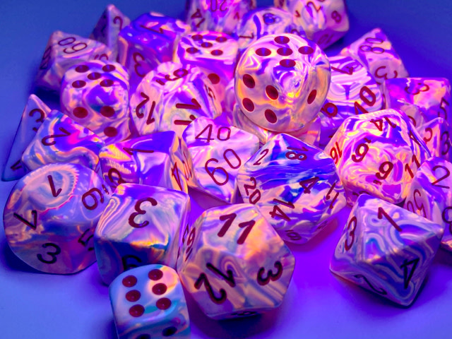 Chessex Chessex - Dés Festive Black Light - Pop Art et Rouge