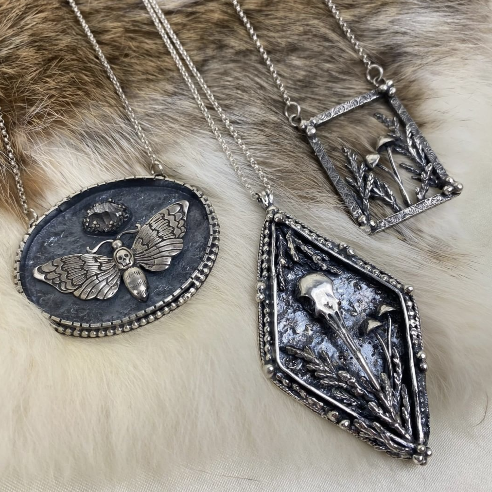Diamond Shaped Hummingbird Skull Necklace · Silver