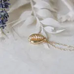 *Cowrie Shell Charm Necklace · Gold