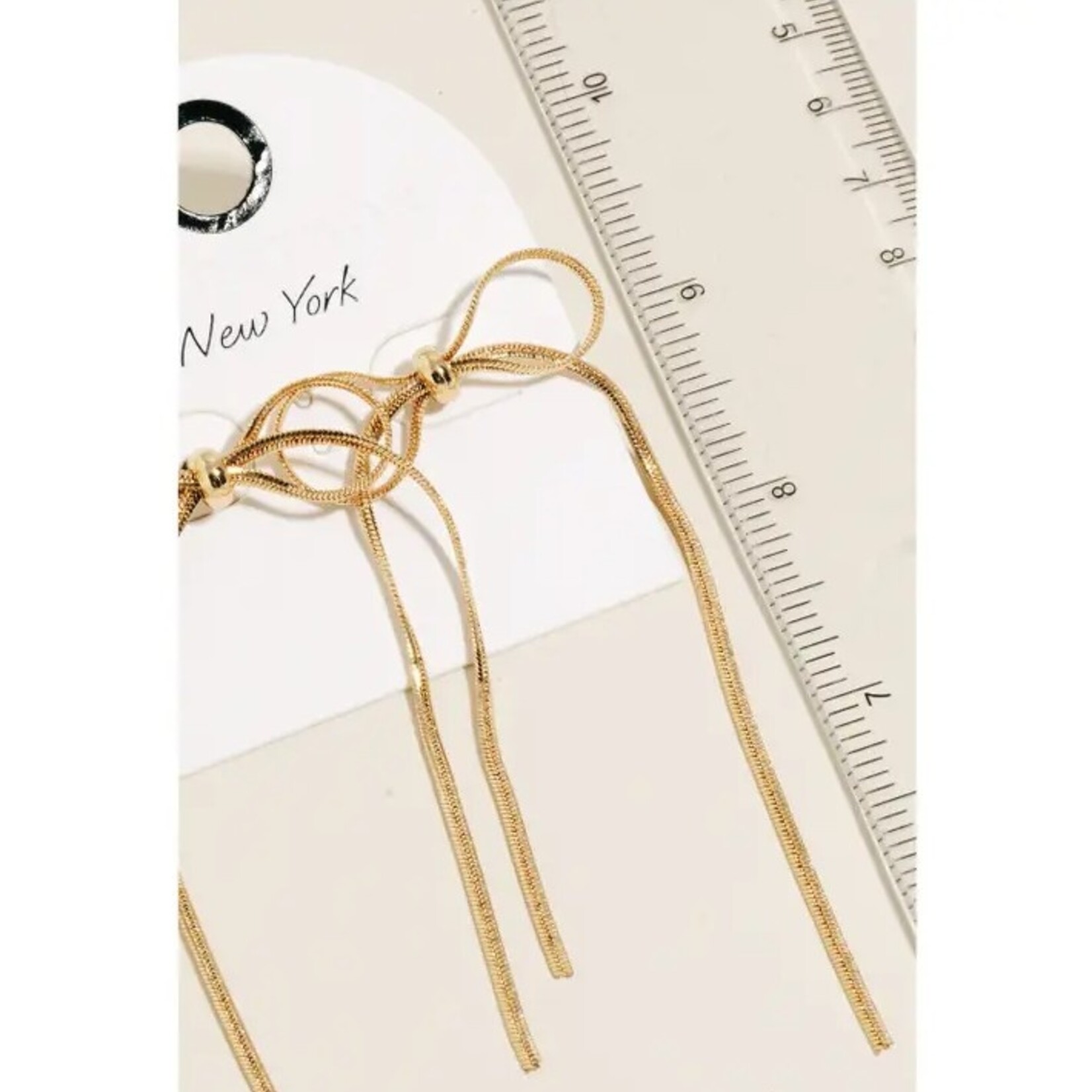 Long Dainty Metallic Ribbon Bow Stud Dangle Earrings · Gold