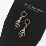 Skeleton Hand Huggie Earrings · Gold