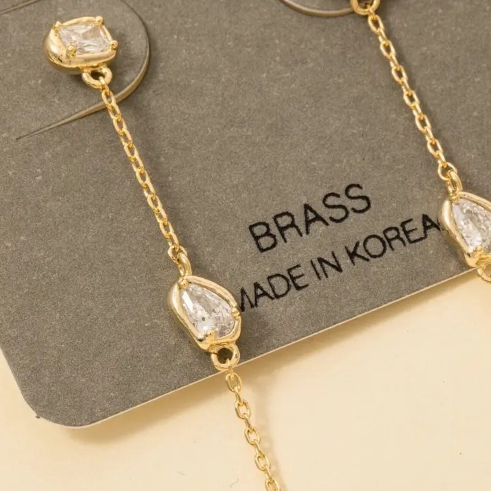 CZ Tear Drop Gem Chain Dangle Earrings · Gold