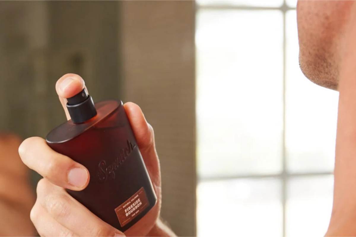 Man applying cologne