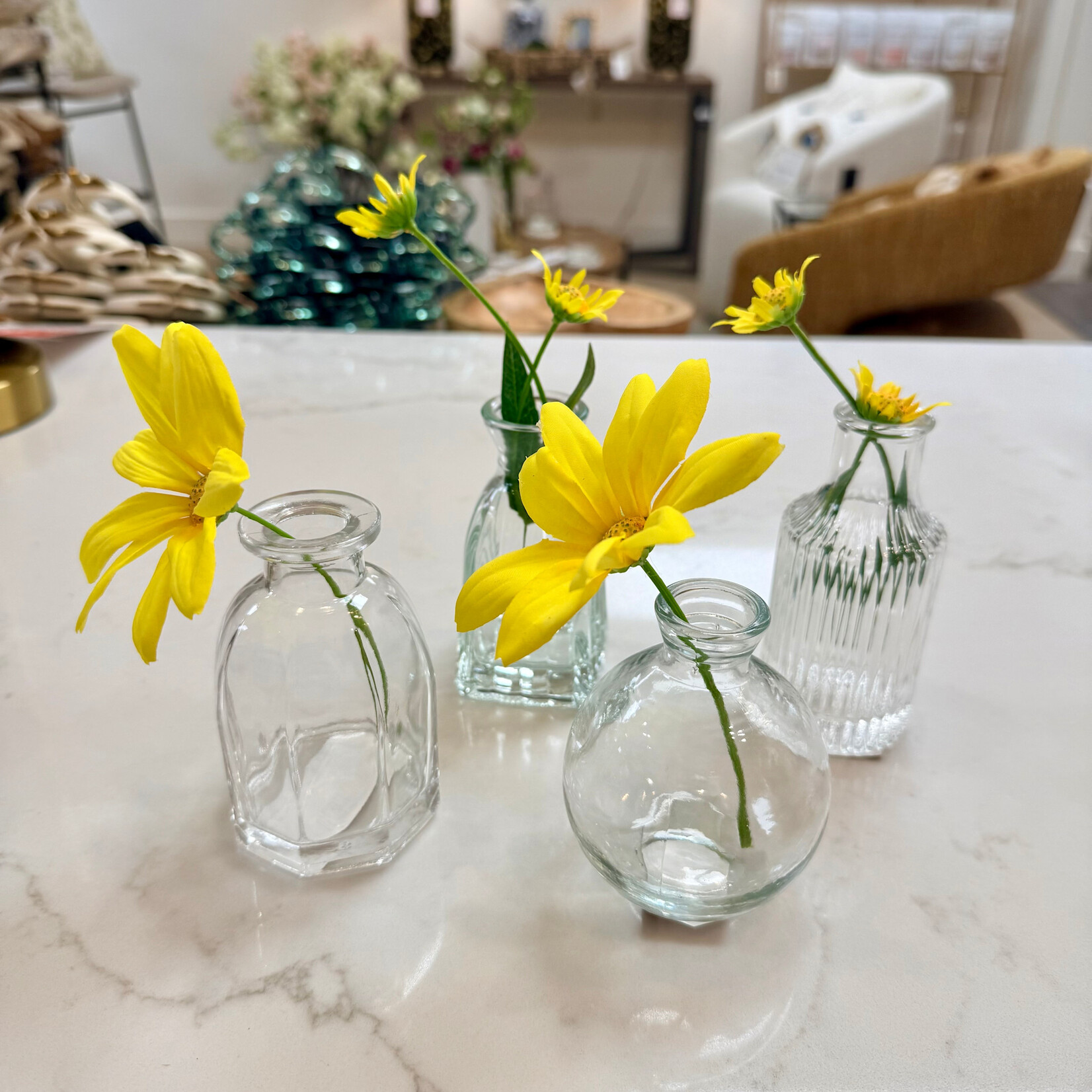 Assorted clear bud vases