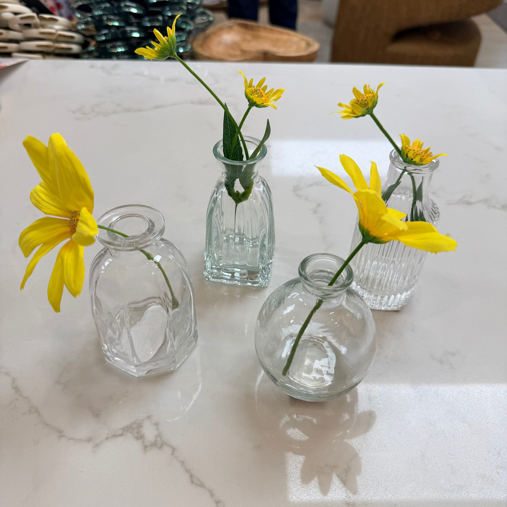 Assorted clear bud vases