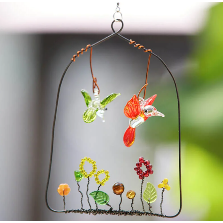 Two Small Hummingbirds over Glass Garden