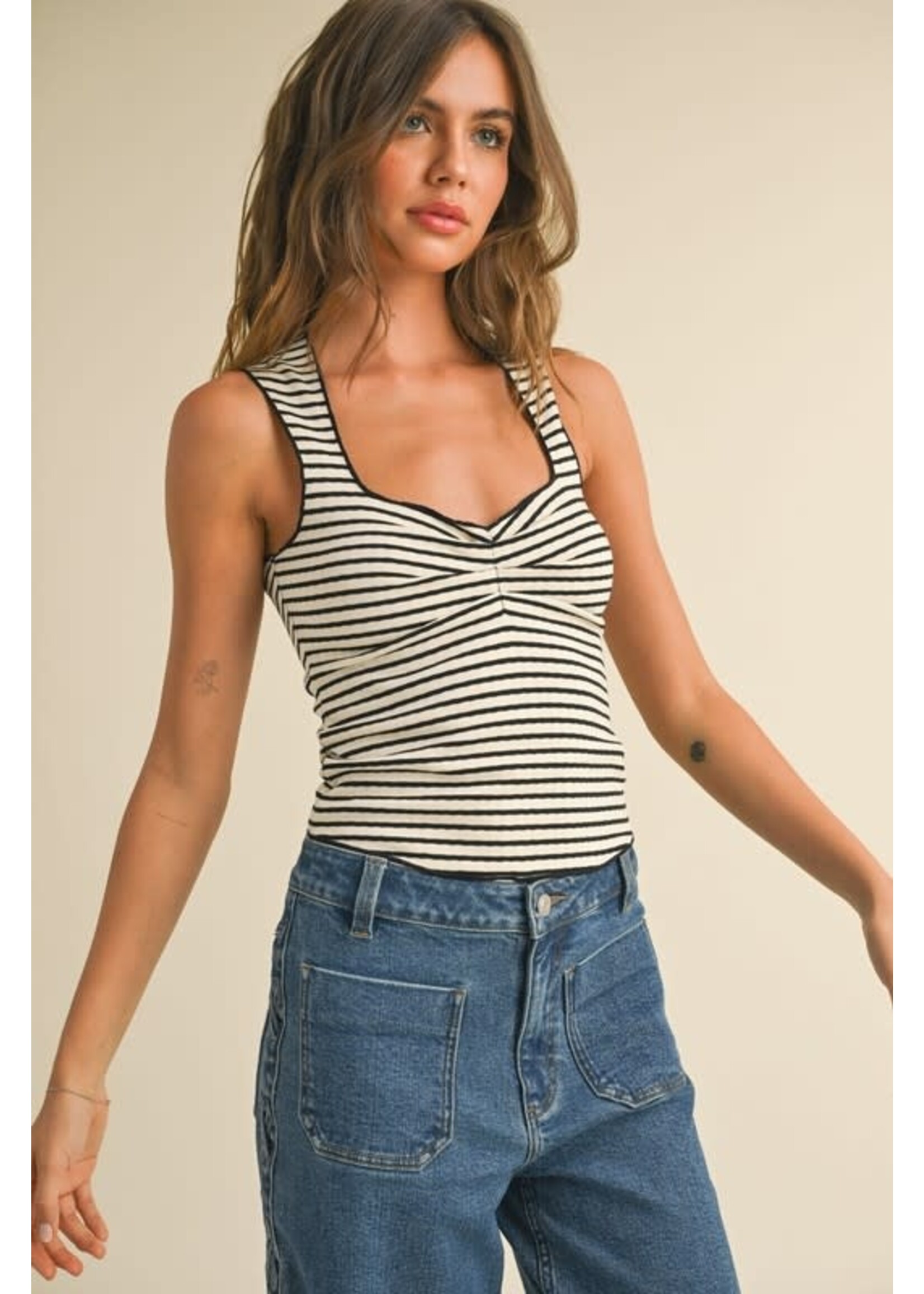 STRIPED KNITTED TOP WITH MERROW END