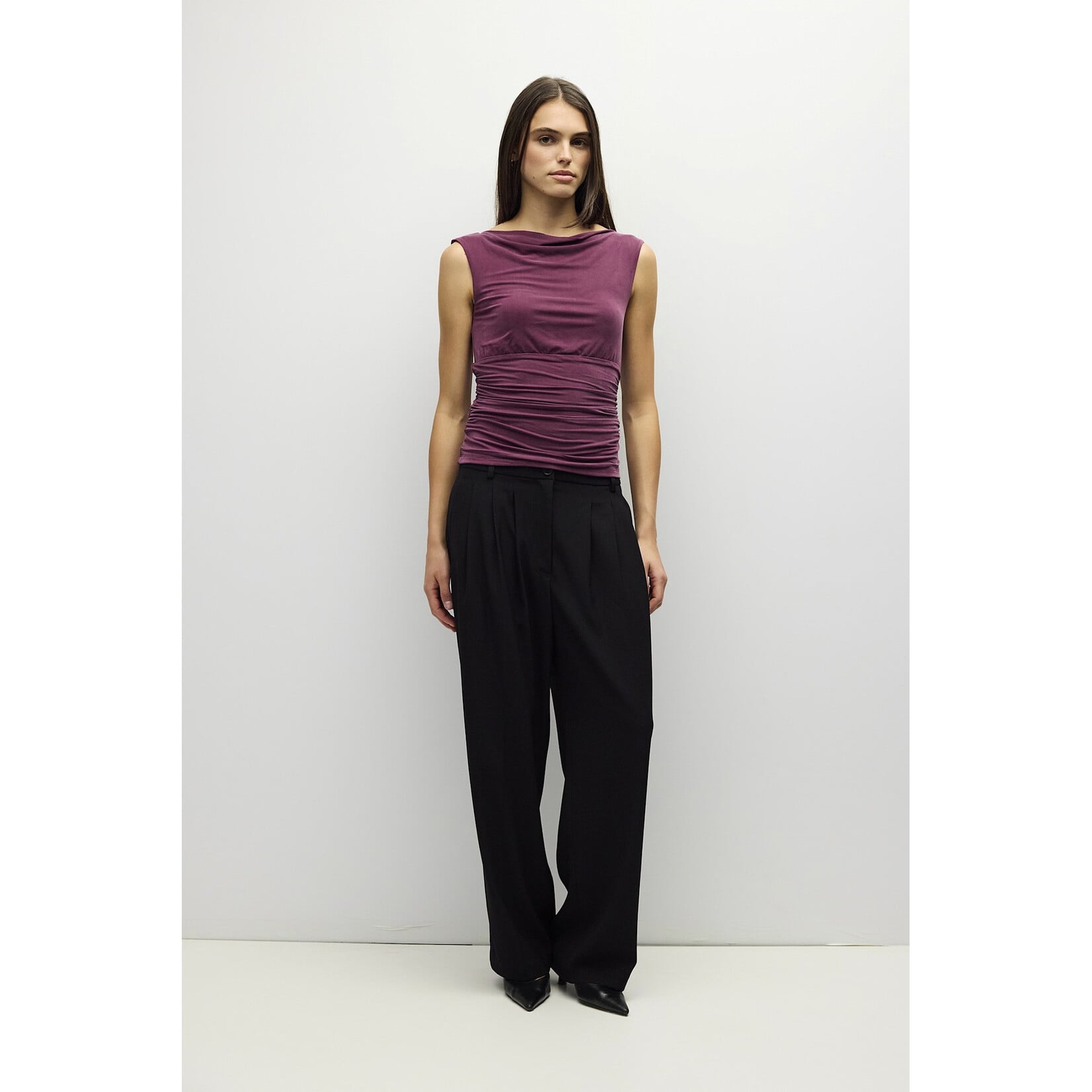 AVAILABLE IN PLUM, BLACK, AND BROWN