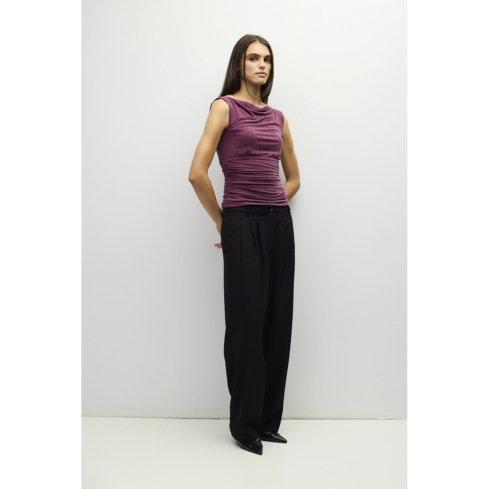 AVAILABLE IN PLUM, BLACK, AND BROWN