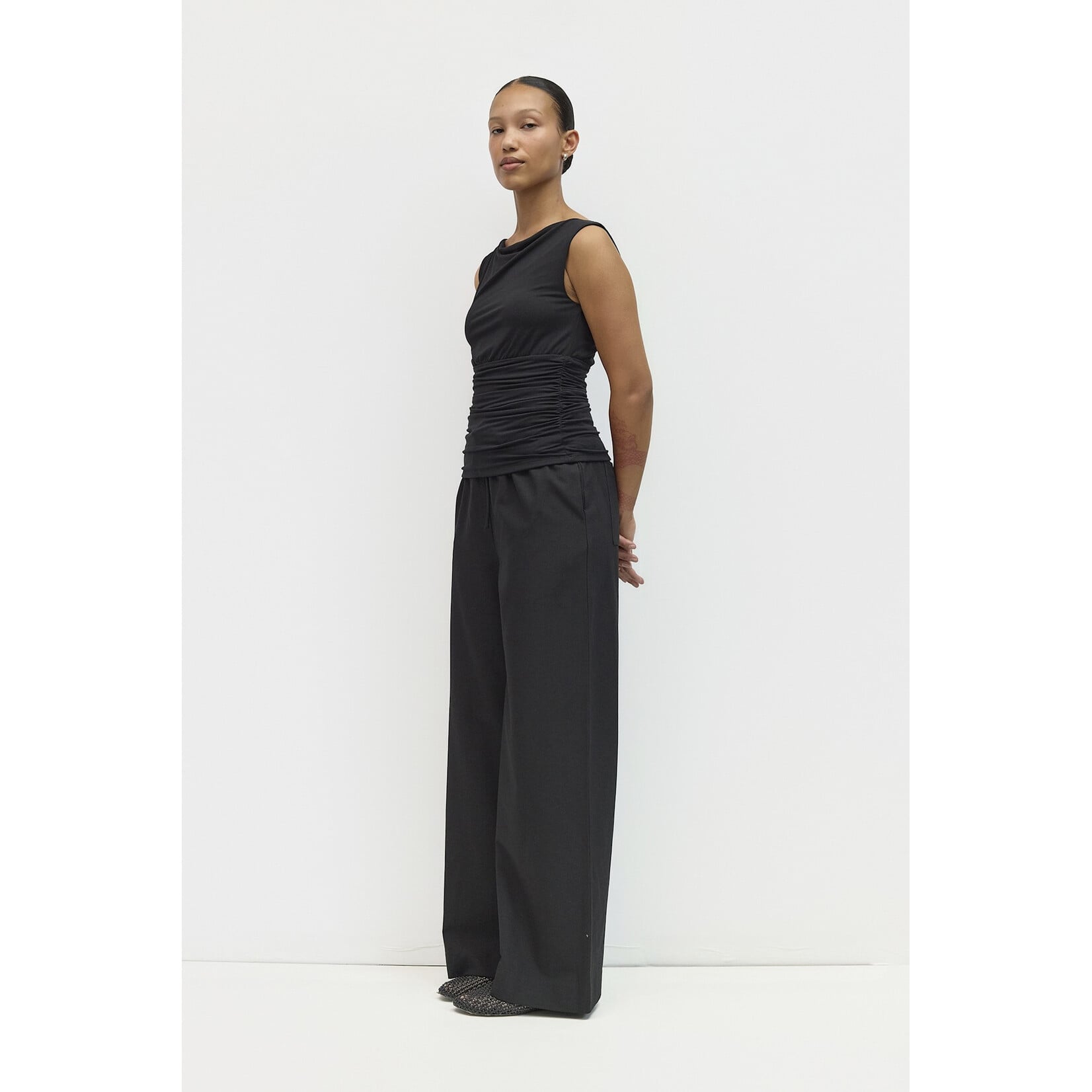 AVAILABLE IN PLUM, BLACK, AND BROWN