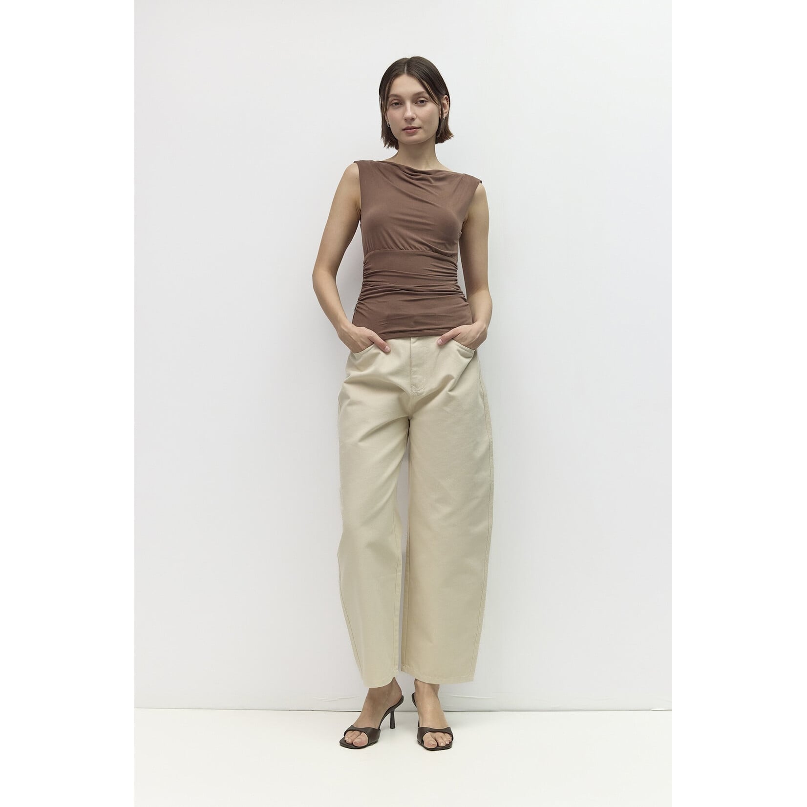 AVAILABLE IN PLUM, BLACK, AND BROWN