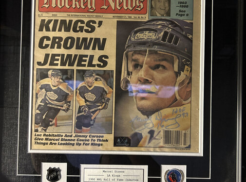 MARCEL DIONNE SIGNED FRAMED HOCKEY NEWS WITH PINS