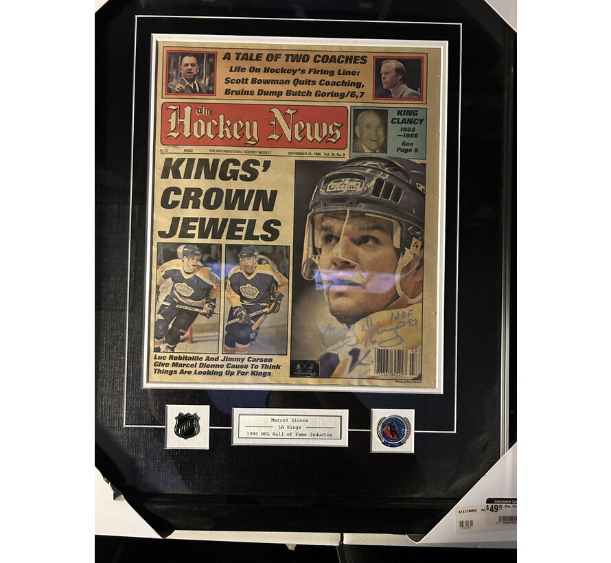 MARCEL DIONNE SIGNED FRAMED HOCKEY NEWS WITH PINS