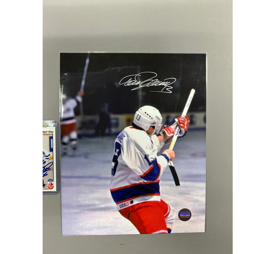 TEEMU SELANNE AUTOGRAPHED WINNIPEG JETS PHOTO (FIRING HOCKEY STICK) 8X10