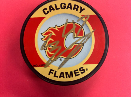 CONNOR ZARY AUTOGRAPHED FLAMES PUCK