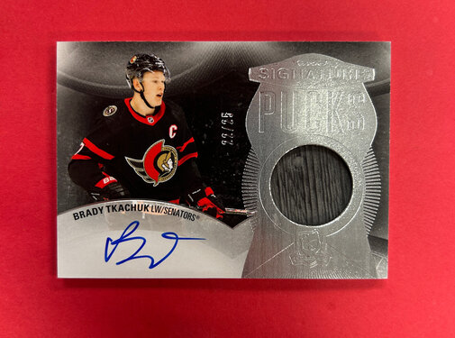 UPPER DECK 2024-25 UPPER DECK THE CUP BRADY TKACHUK SIGNATURE PUCKS /25